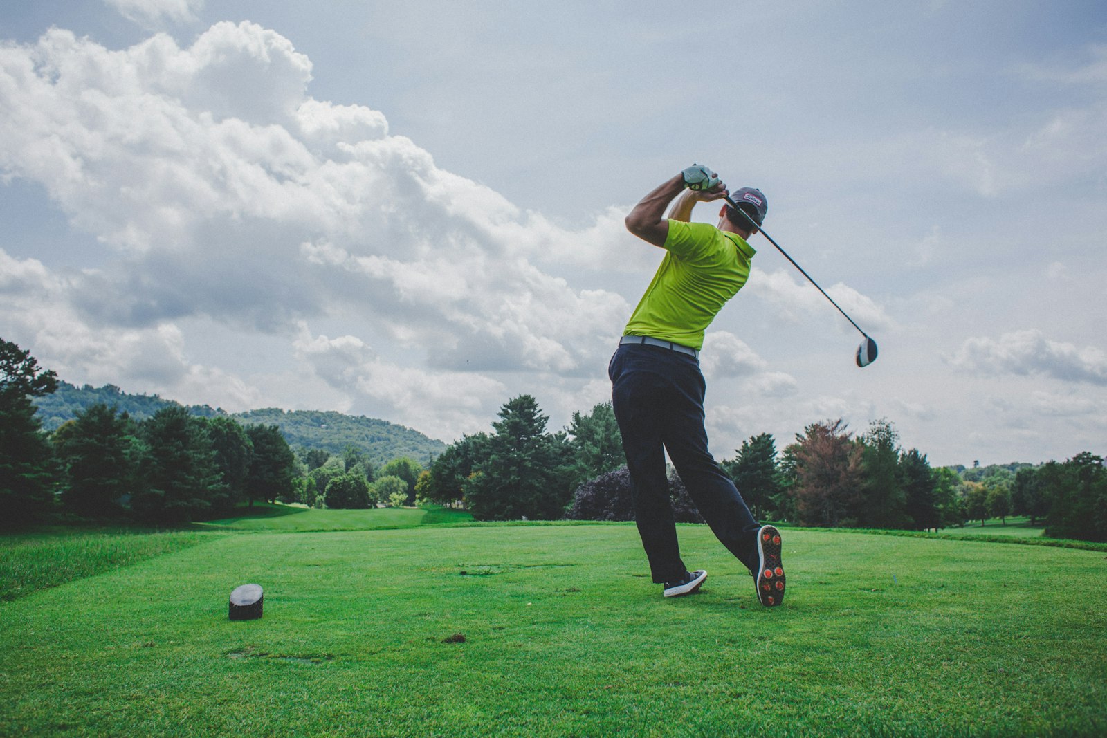 Golfer practicing a driver swing on the range as part of a structured golf practice plan